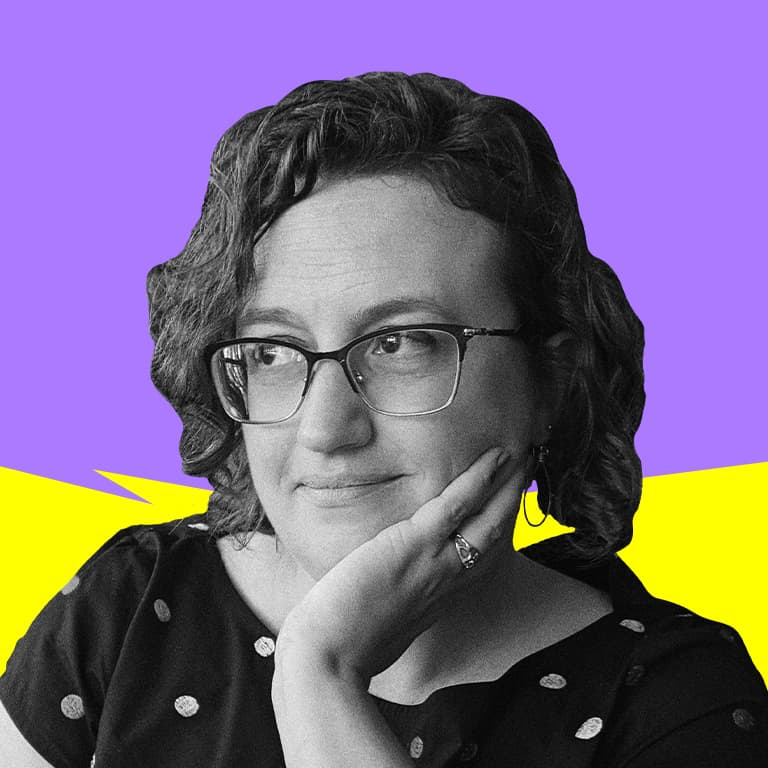 A young African American man with an afro and wearing glasses, pictured in front of a wall with a pink glow, looking away from the camera.